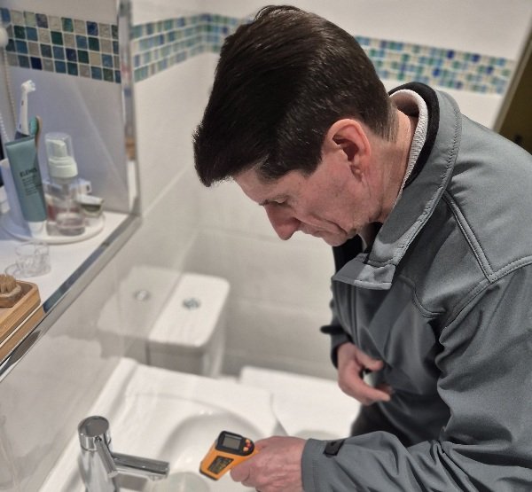 Paul carrying out a professional Legionella risk assessment using specialist testing equipment in Doncaster