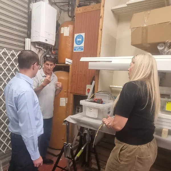 Practical Legionella Responsible Person training beside a commercial hot water system