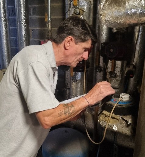 Legionella risk assessor inspecting a commercial water system
